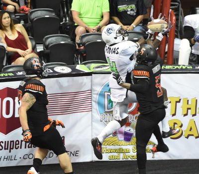 Eric Thomas of the Nebraska Danger and Tyree Robinson, right, of the Spokane Empire both vie for a pass in the endzone. The Empire won 55-44 to advance to the United Bowl against Sioux Falls. (JESSE TINSLEY jesset@spokesmna.com)