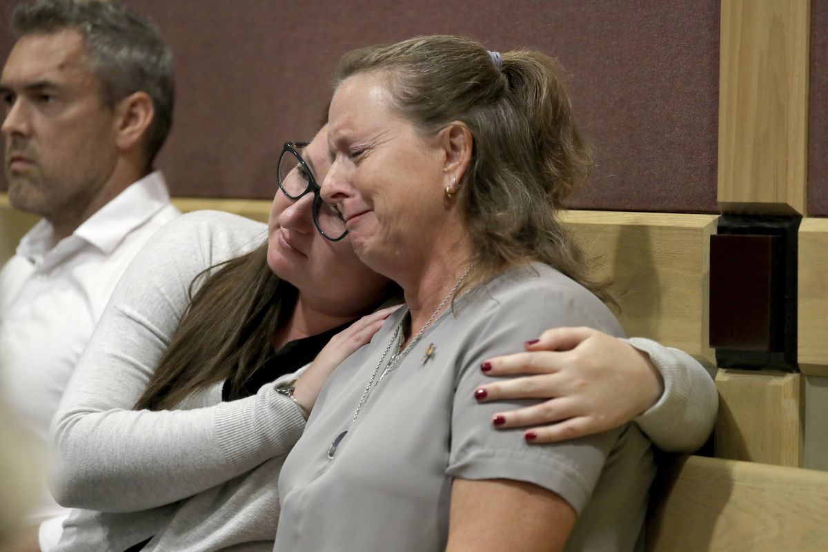 FILE - In this May 1, 2019, file photo, Debbi Hixon, right, the widow of victim Chris Hixon, is consoled in court by family friend Jennifer Valliere during a hearing for Parkland school shooting defendant Nikolas Cruz at the Broward Courthouse in Fort Lauderdale, Fla. It’s been more than 1,000 days since a gunman with an AR-15 rifle burst into a Florida high school, killing 17 people and wounded 17 others. And yet, with Valentine’s Day on Sunday, Feb. 14, 2021, marking the three-year milestone, Cruz’s death penalty is in limbo.  (Mike Stocker)