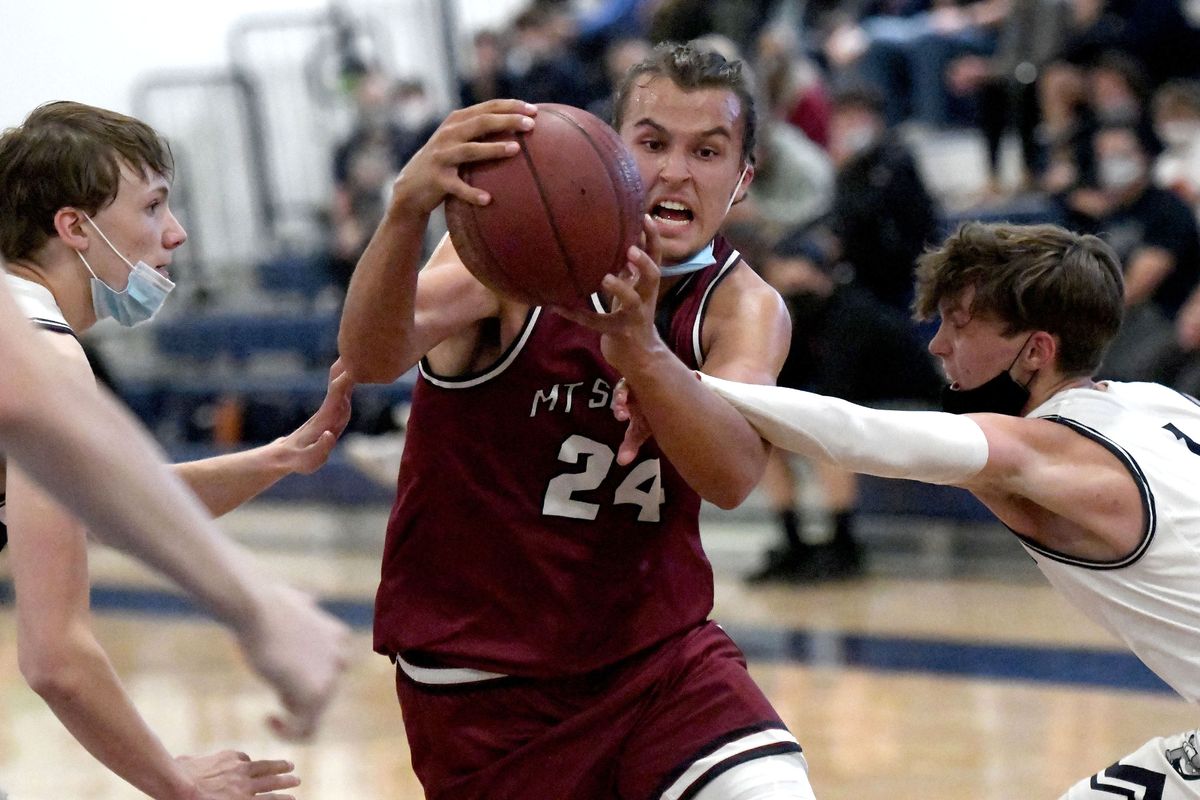 Mt Spokane’s Tyson Degenhart, the reigning Greater Spokane League MVP, drives the lane against Gonzaga Prep in Spokane on Tues. May 18, 2021.  (kathy plonka)