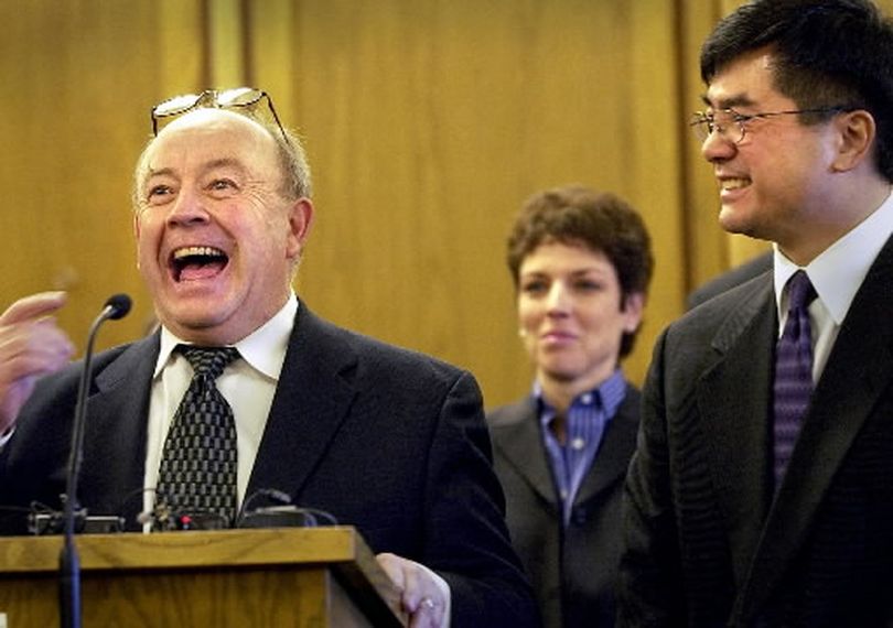 In this 2003 photo, Jerome Leveque shares a laugh during an announcement by hen-Gov. Gary Locke, right, that Leveque and private defense attorney Maryann Moreno, center, were the new Superior Court judges Friday. (Brian Plonka / The Spokesman-Review)