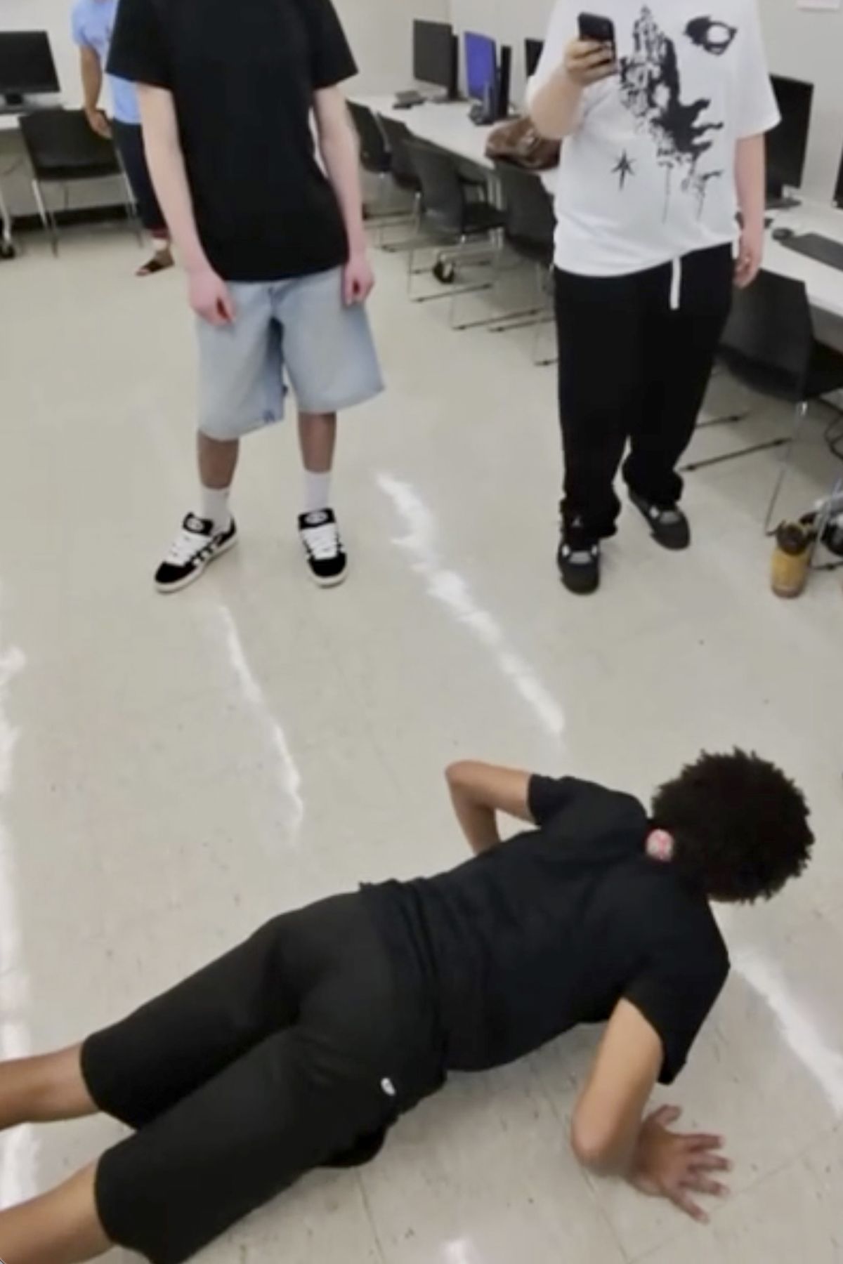 A screenshot provided via Joey Finke of an undated video shows young people playing hacky sack. For young footbag enthusiasts at Wolcott High School in Connecticut, complexity is a feature, not a bug. (New York Times )