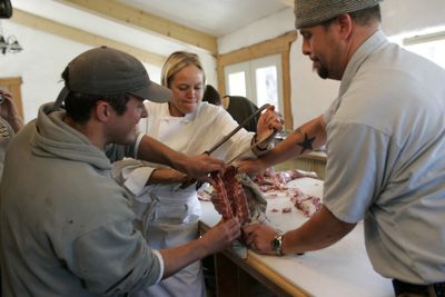 Photo courtesy of Harley Soltes Kären Jurgensen, chef instructor at Quillisascut Farm School and the Seattle Culinary Academy, works with students fabricating meat, or breaking it down into usable cuts. Students have a hands-on role in butchering the animals. (Photo courtesy of Harley Soltes / The Spokesman-Review)