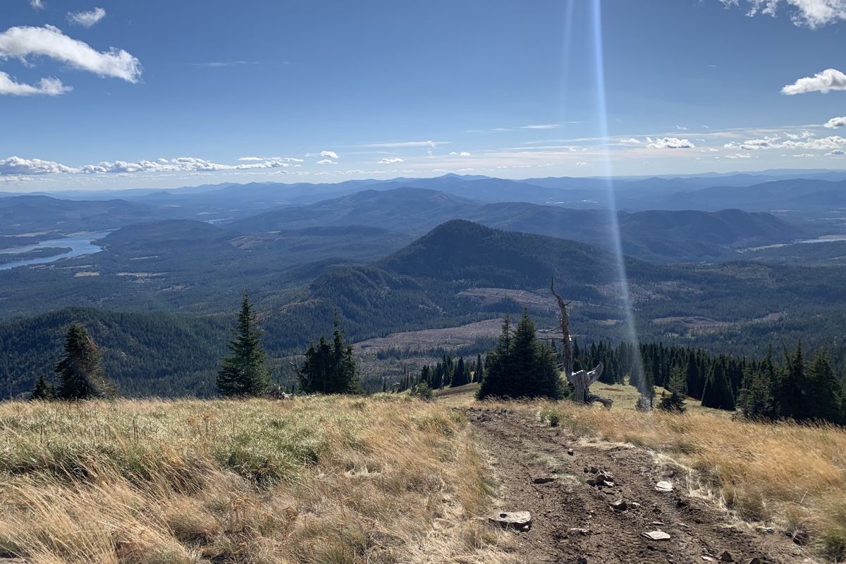 From the top of Baldy Mountain, views of the Pend Oreille River and southern Selkirks stretch below the skyline.  (Gideon Chadwick/courtesy)