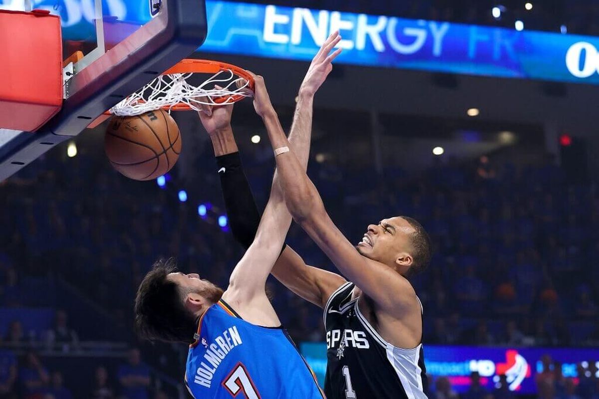 Spurs center Victor Wembanyama dunks on Thunder forward Chet Holmgren during Game 7 of the Western Conference finals on Saturday at Paycom Center in Oklahoma City. 