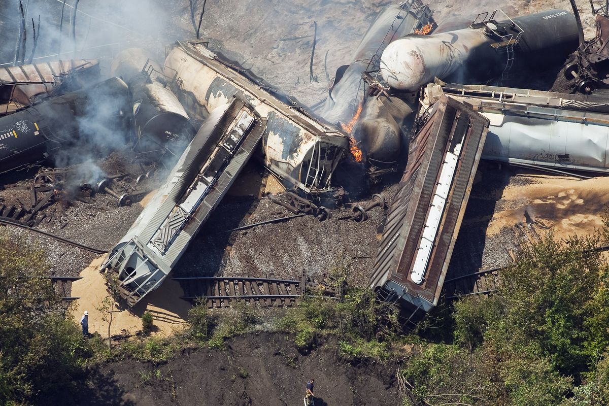 In this July aerial photo, a freight train is seen after an early morning derailment in Columbus, Ohio. Part of the freight train carrying ethanol derailed and caught fire. (Associated Press)