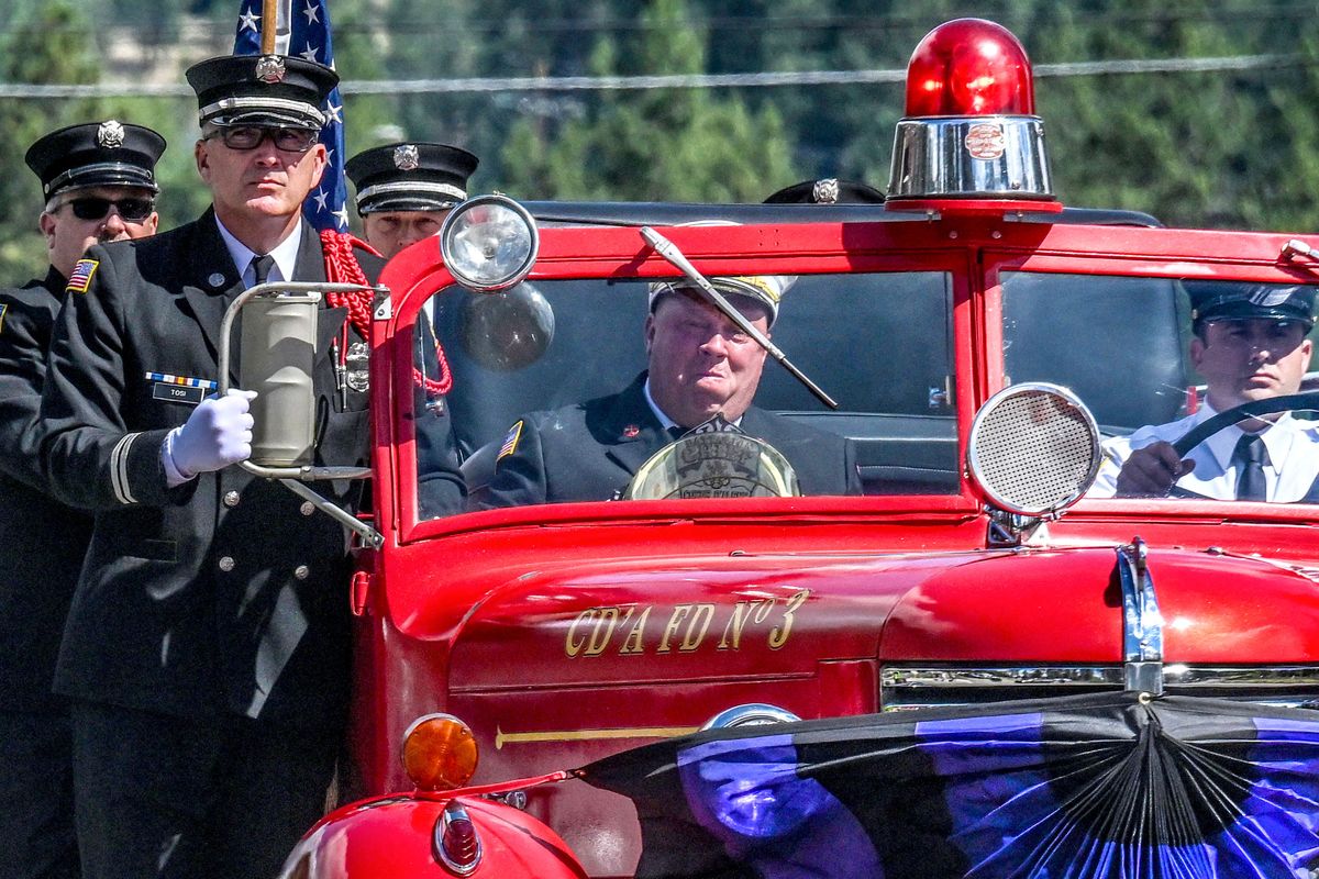 Members of the Coeur d’Alene Fire Department transport the body of Battalion Chief John Morrison during the procession for his funeral in Coeur d’Alene on Thursday. Morrison and Kootenai Fire & Rescue Battalion Chief Frank Harwood were shot and killed while tending to a fire on Canfield Mountain on June 29. (Kathy Plonka/The Spokesman-Review)