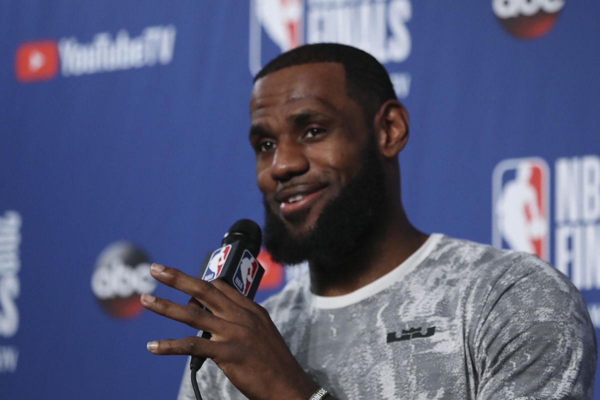 Cleveland Cavaliers forward LeBron James takes questions at a press conference after the basketball team