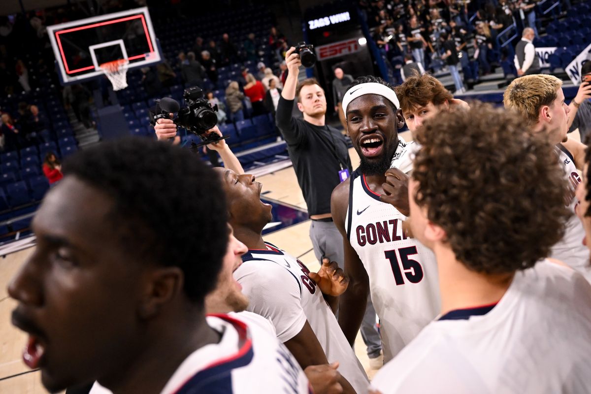 Gonzaga Bulldogs forward Graham Ike (15) cheers with forward Emmanuel Innocenti (5) after they defeated the Saint Mary
