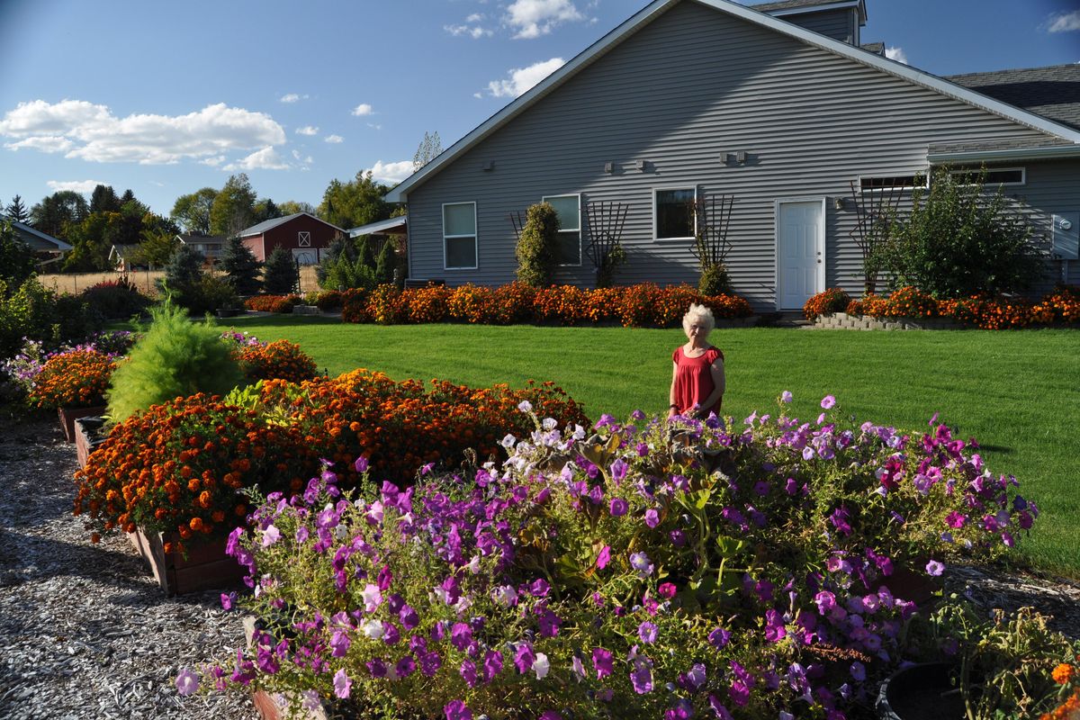 Ellie Mae Holm shows off her show stopping garden on South Sullivan road in the Spokane Valley. She grows most of her plants from seed each year. Her garden was the September Garden of the Month winner (Pat Munts/Special to The Spokesman-Review)
