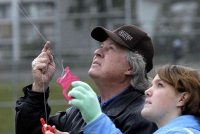 
Jesse Robbins, left, and Shyan Jones, 12, watch their kites fly Saturday above Finucane Park in Hayden.  Children, adults and groups showed up at the Kites for Kids Festival to fly kites and compete for awards.  
 (Jesse Tinsley / The Spokesman-Review)