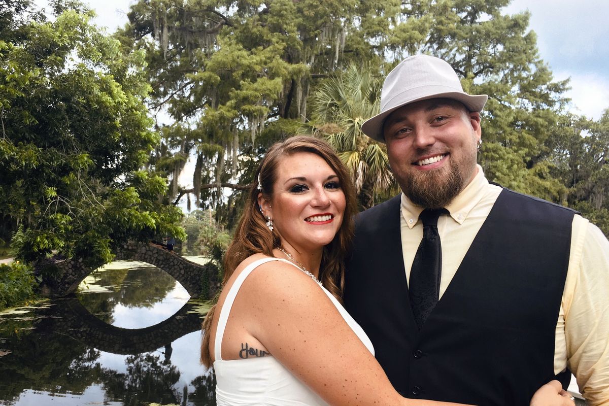 Jordan Tyler, right, with his wife, Brittany, in New Orleans on July 18. The couple signed up for Match.com, started texting March 18 and were wed by July.  (HONS)