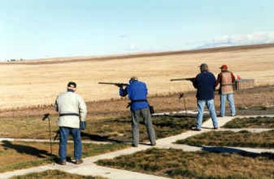 
Harry Grennay, left, and Chuck Booth, second from left, join a group of trapshooters at the West Deep Creek Gun Club west of Spokane. Grennay built the shotgun shooting facility on his 40 acres overlooking farm fields. 
 (Rich Landers / The Spokesman-Review)