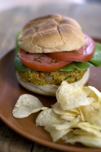 This veggie burger can be topped with cheddar and mayonnaise or tzatziki or hummus. (Associated Press)