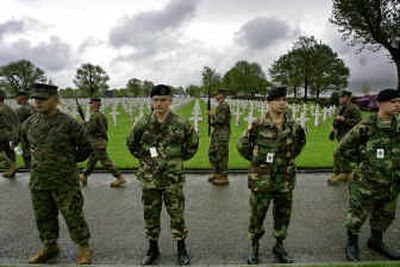 U.S. soldiers rehearse near graves of U.S. military World War II victims at the Netherlands American Cemetery in Margraten on Saturday. President Bush will attend a ceremony in Margraten marking today's 60th anniversary of V-E Day. 
 (Associated Press / The Spokesman-Review)