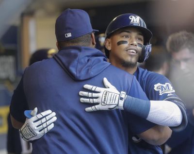 Milwaukee Brewers’ Orlando Arcia, right, is congratulated by Jesus Aguilar after hitting a three-run home run during the fourth inning against the Seattle Mariners on Thursday in Milwaukee. (Morry Gash / AP)