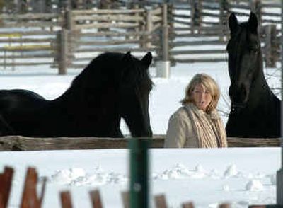 
Martha Stewart passes her horses at her home in Katonah, N.Y., Friday, the first day of the home-confinement portion of her sentence. 
 (Associated Press photos / The Spokesman-Review)