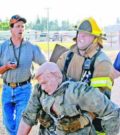 
Bob Capaul, left, monitors firefighter trainees in one of his classes in this  fire department snapshot. 
 (Photos courtesy of Kootenai County Fire and Rescue / The Spokesman-Review)
