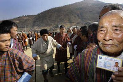 
Bhutanese  line up to cast their votes outside a polling station Monday. The secluded Himalayan nation of Bhutan  became the world's newest democracy on Monday.Associated Press
 (Associated Press / The Spokesman-Review)