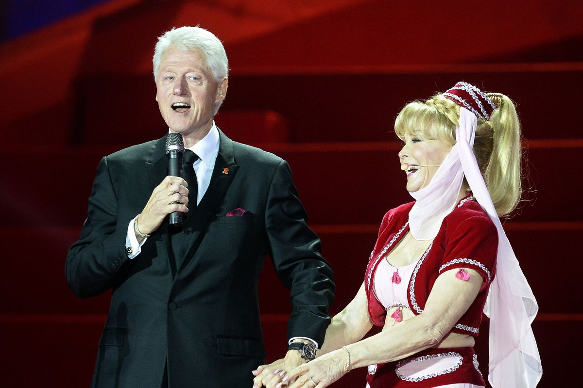 Former President Bill Clinton delivers a speech next to actress Barbara Eden during the opening ceremony of the Life Ball in Vienna, Austria, on Saturday. (Associated Press)