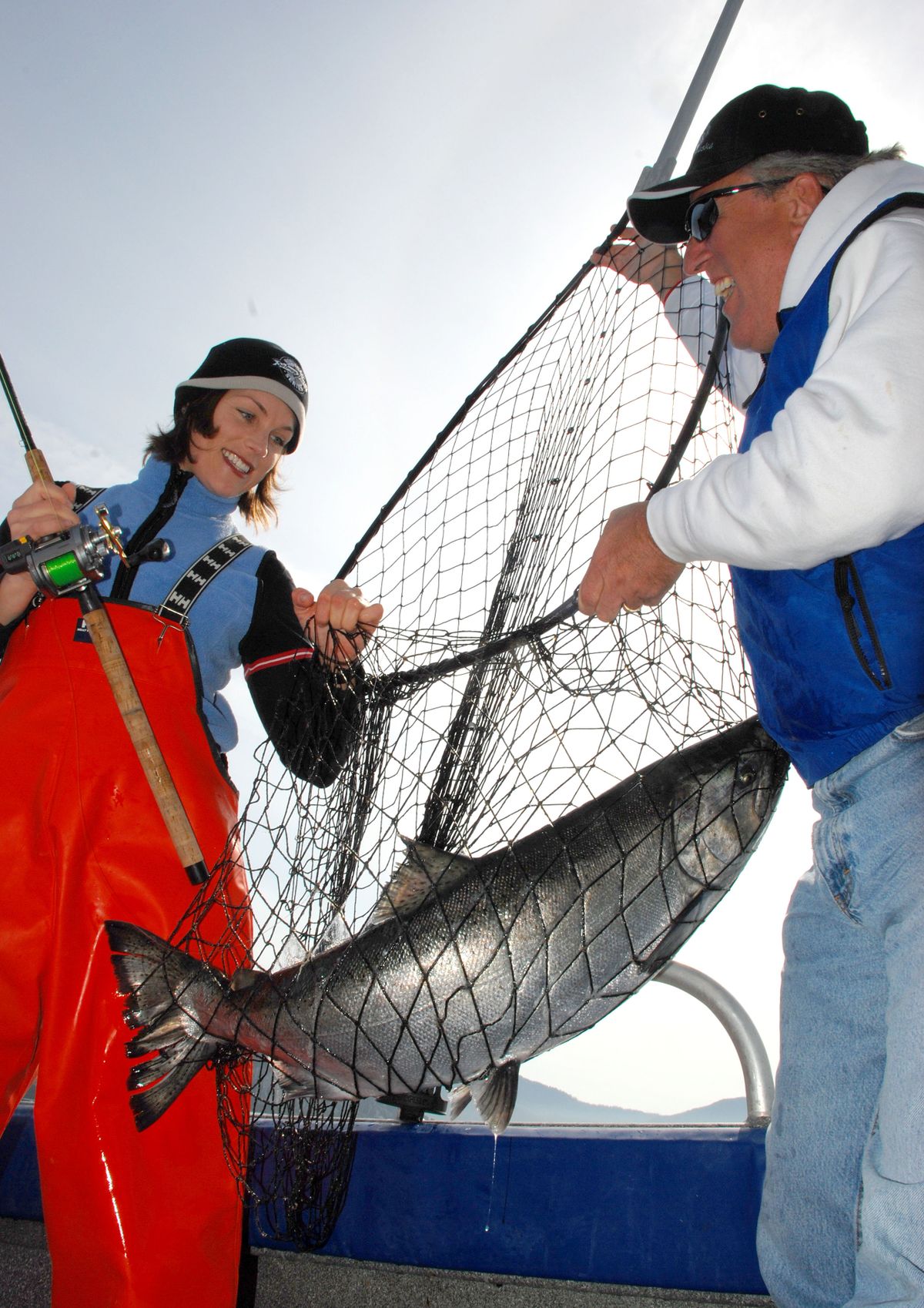 Anglers land bright king salmon near Sitka, Alaska. (Rich Landers)