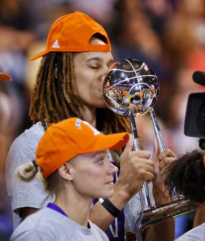 Mercury center Brittney Grinder kisses the WNBA championship trophy after Phoenix beat Chicago. (Associated Press)