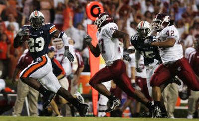 
Washington State defenders Eric Frampton, center, and Scott Davis chase Auburn running back Kenny Irons in the first half on Saturday in Auburn, Ala.
 (Associated Press / The Spokesman-Review)