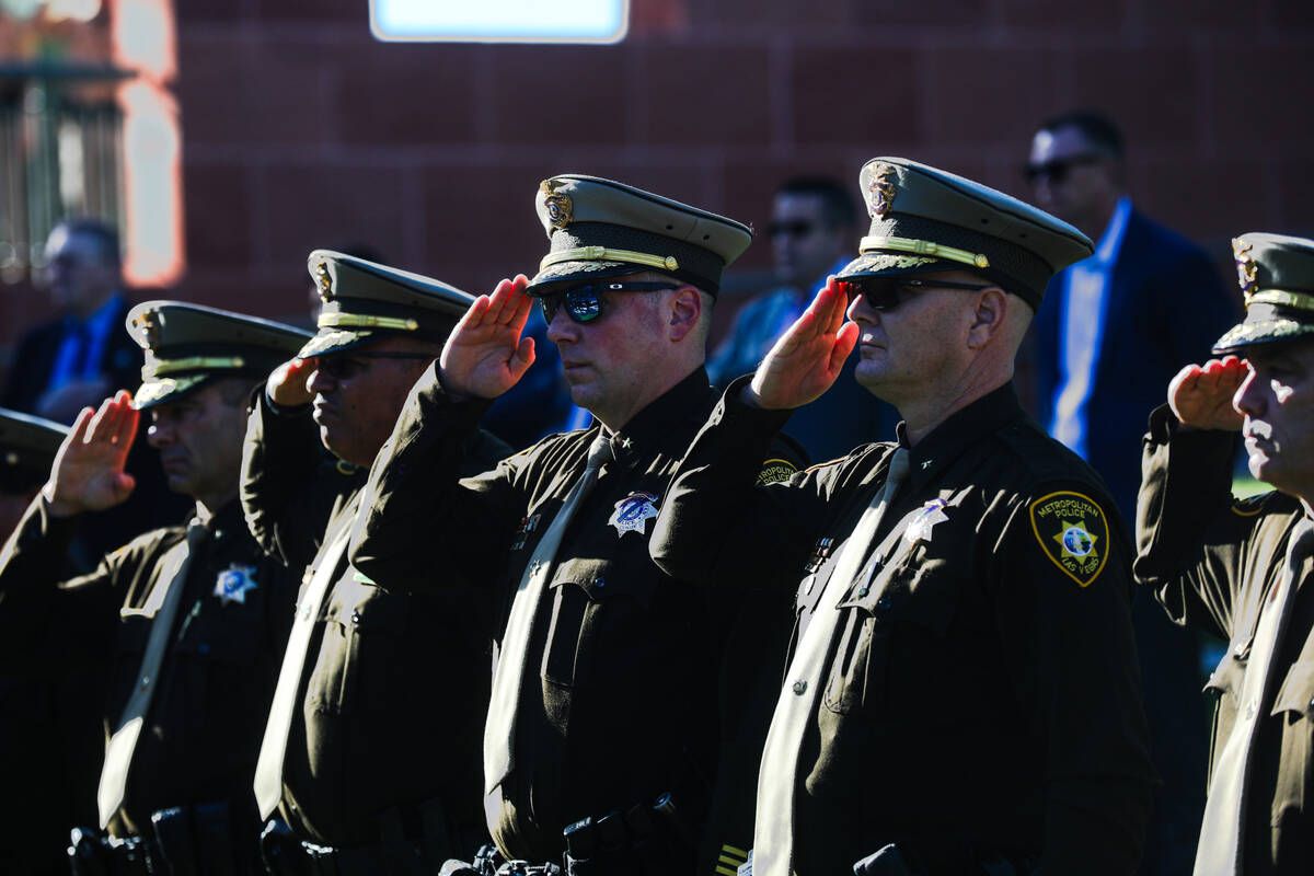 Members of the Metropolitan Police Department salute during the 1 October Sunrise Remembrance ceremony at the Clark County Government Center Amphitheater in Las Vegas, Sunday, Oct. 1, 2023.   (Rachel Aston/Las Vegas Review-Journal/TNS)