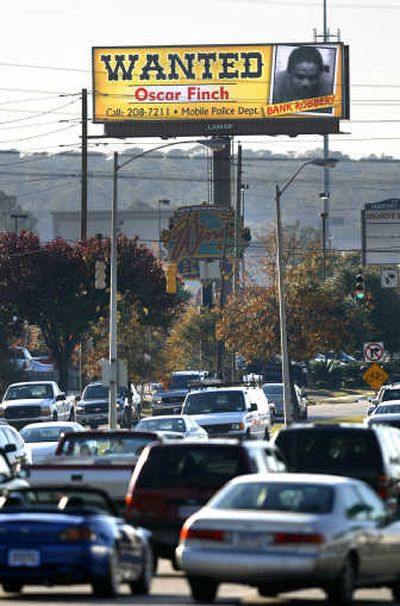 
The Mobile Police Department uses photo billboards to broadcast the names of violent criminals or missing persons.Associated Press
 (Associated Press / The Spokesman-Review)