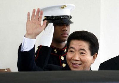 
South Korea's President Roh Moo-hyun walks past  a saluting Marine after meeting with President Bush.
 (Associated Press / The Spokesman-Review)
