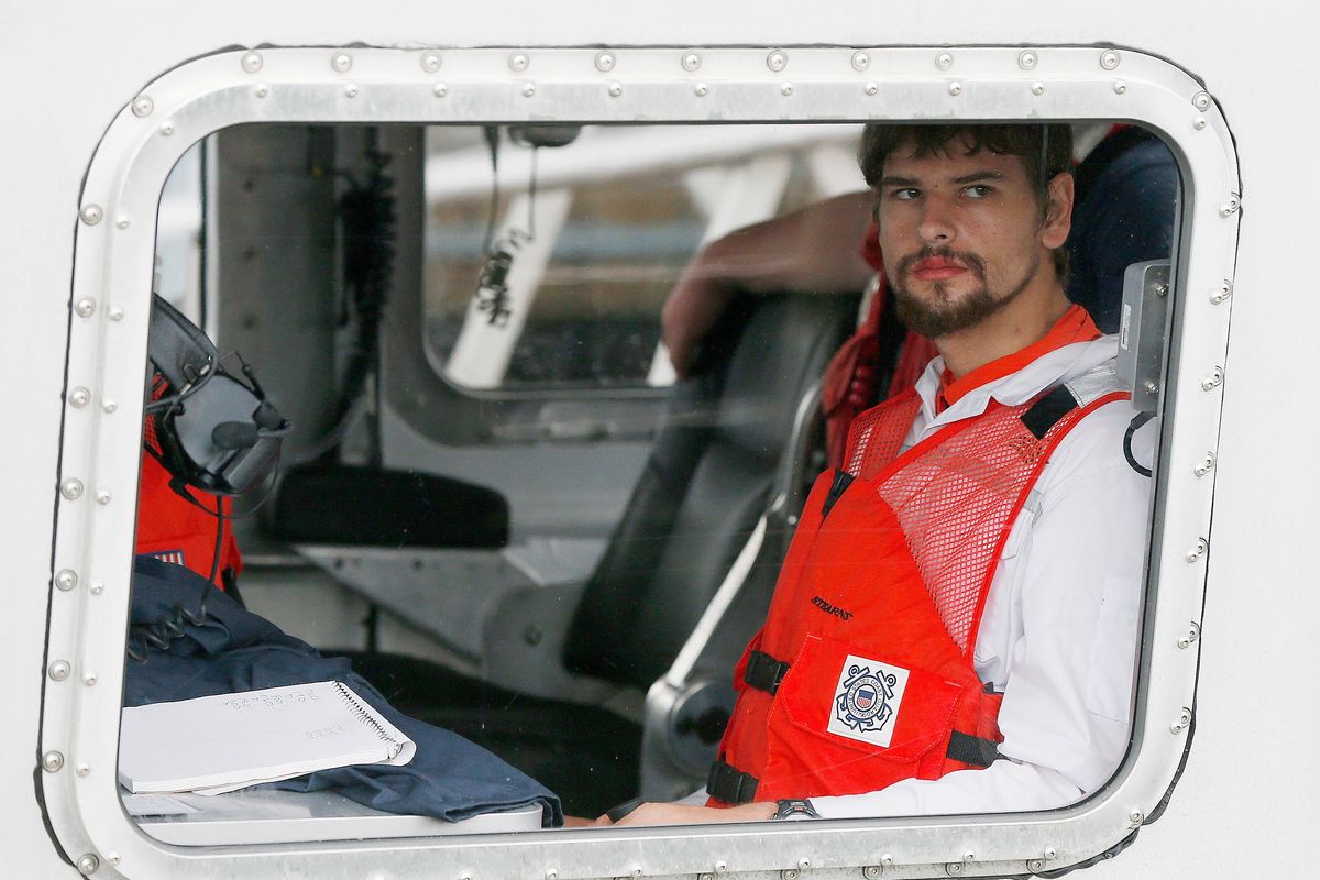 FILE — Nathan Carman arrives in a small boat at the US Coast Guard station, in Boston, Tuesday, Sept. 27, 2016. Carman spend a week at sea in a life raft before being rescued by a passing freighter. Carman is to be arraigned in federal court, in Rutland, Vt., Wednesday, May 11, 2022, on charges of killing his mother during a fishing trip at sea to inherit the family