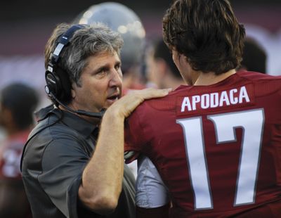 If Cougars take a big lead, WSU coach Mike Leach, left, might get backup quarterback Austin Apodaca a few more snaps. (Associated Press)