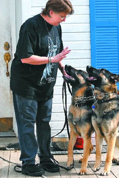 
Kat Peterson gives a command to two of her prized German shepherds, Electra and Isidora, at her home
 (Jesse Tinsley / The Spokesman-Review)