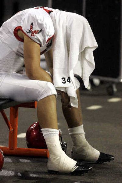 
Eastern Washington quarterback Chris Peerboom sat out the fourth quarter after suffering a mild concussion.
 (Associated Press / The Spokesman-Review)