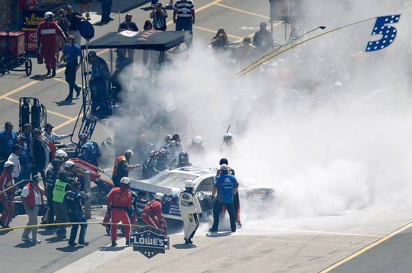 Safety crews attend to the No. 55 of Mark Martin after an accident on pit road. (Photo Credit: Wesley Hitt/Getty Images for NASCAR) (Wesley Hitt / Getty Images North America)