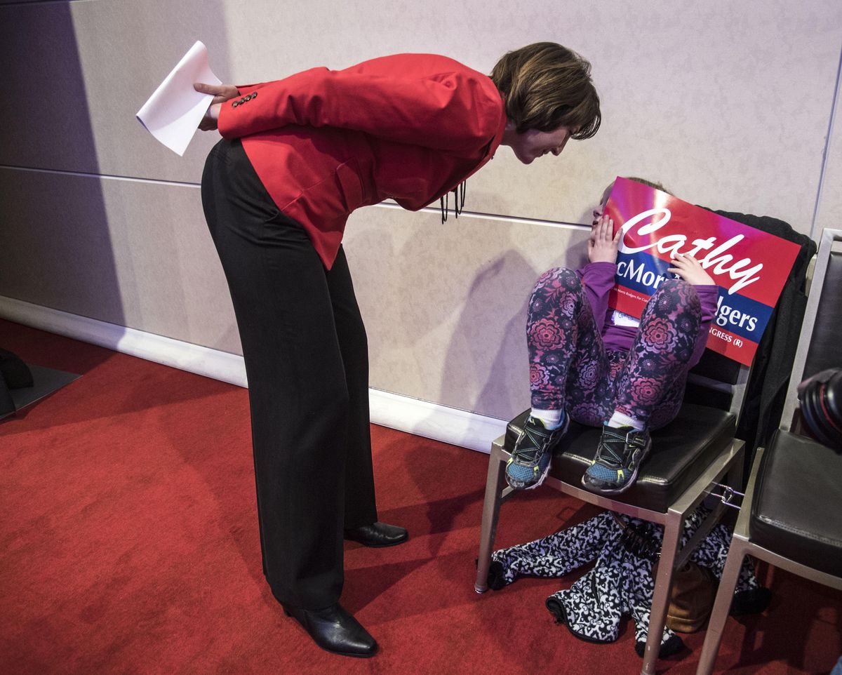 Congresswoman Cathy McMorris Rodgers chats with a shy Ginger Allbee, 6, before McMorris Rodgers took to the stage to thank the gathering at the Davenport Hotel for her support, Nov. 8, 2016. (Dan Pelle / The Spokesman-Review)
