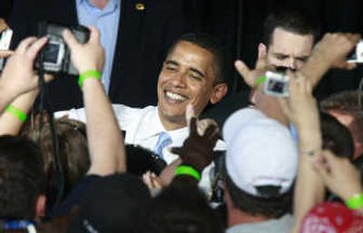 
Sen. Barack Obama shakes hands with supporters at a rally Thursday at Nissan Pavilion in Bristow, Virginia. Associated Press
 (Associated Press / The Spokesman-Review)