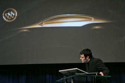 
Justin Thompson, General Motors' lead designer, draws a portion of the Invicta concept car during a Buick news conference Tuesday  in New York. Associated Press
 (Associated Press / The Spokesman-Review)