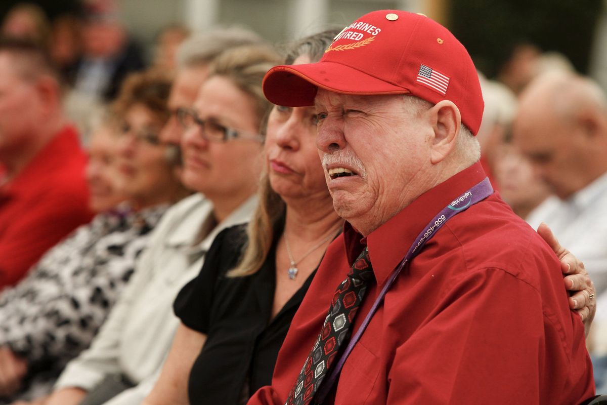 Kenneth Pollock weeps Friday while he listens to the details of a battle he was involved with 46 years ago, while fellow Vietnam-era Marines Joe Cordileone and Robert Moffatt are honored in a ceremony for their bravery in combat during the first battle of Khe Sanh in 1967.