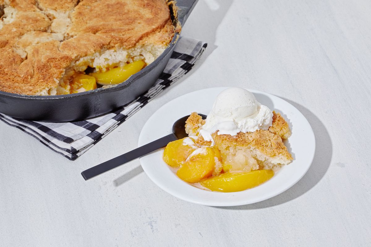 The cobbler, such as this peach-apple version, generally consists of a dough draped over the top of the fruit. MUST CREDIT: Tom McCorkle/For The Washington Post (Tom McCorkle for The Washington /Food styling by Lisa Cherkasky f)