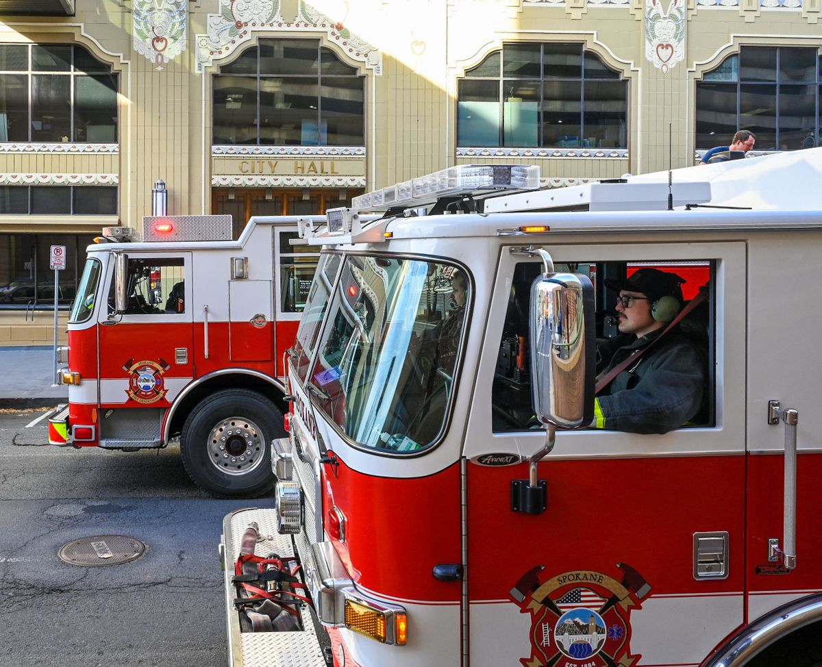 Spokane Fire Department crews check out an alarm on the seventh floor of Spokane City Hall on Thursday.  (DAN PELLE/THE SPOKESMAN-REVIEW)
