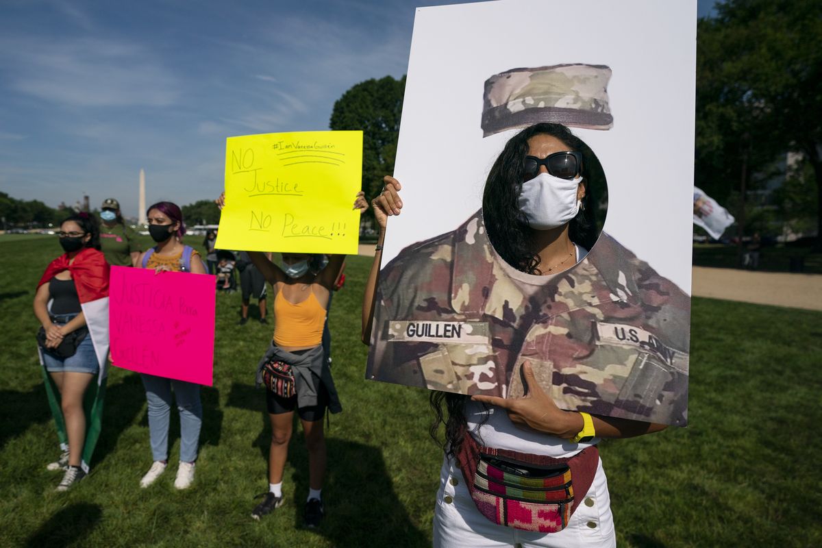Supporters of the family of slain Army Spc. Vanessa Guillen, including Susana Vaca, right, gather before a news conference on the National Mall in front of Capitol Hill, Thursday, July 30, 2020, in Washington.  (Carolyn Kaster)
