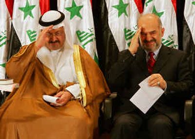 
Iraqi interim President Ghazi al-Yawar and his deputy, Ibrahim Jaffari, salute before taking their oaths of office.
 (Agence France Presse/Getty Images / The Spokesman-Review)