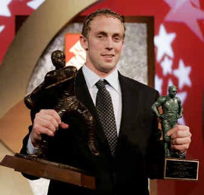 
Jason White, a senior quarterback from Oklahoma, shows off the Davey O'Brien Award, left, and the Maxwell Award. 
 (Associated Press / The Spokesman-Review)