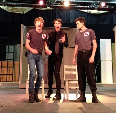 From left, Jackson Bulger, Canyon O’Neil, and Caleb Patterson rehearse a scene in Gonzaga Prep’s production of “Fahrenheit 451.”