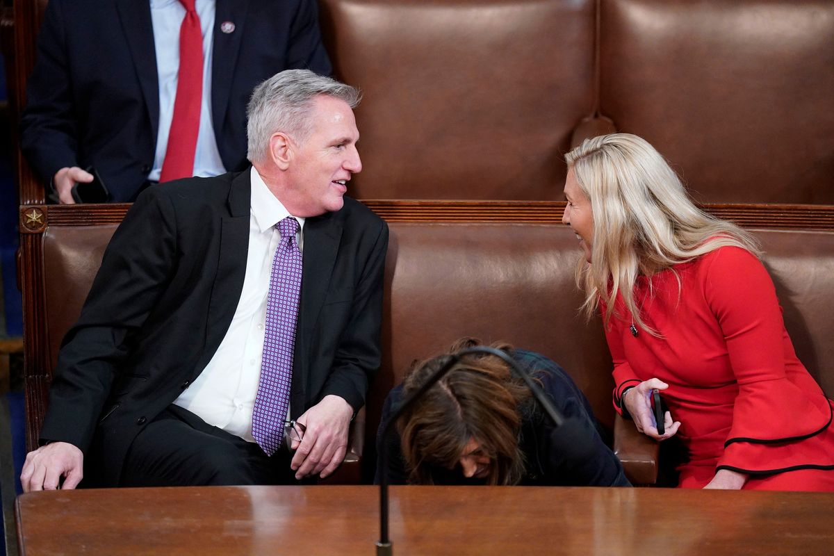 Kevin McCarthy (R-Calif.), left, speaks with Marjorie Taylor Greene (R-Ga.) on the second day of the 118th Congress, Jan. 4.  (Jabin Botsford/The Washington Post)