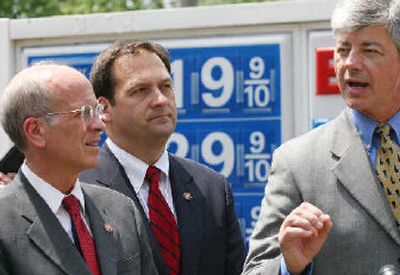 
Rep. Bart Stupak, D-Mich., right, accompanied by Rep. Peter Welch, D-Vt., left, and Christopher Carney, D-Pa., center, answers a reporter's question during a news conference at a gas station on Capitol Hill on Wednesday.  
 (Associated Press / The Spokesman-Review)