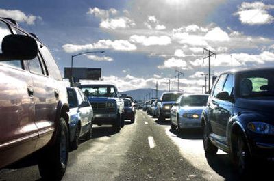 
Traffic near the intersection of Sullivan and Broadway in Spokane Valley  backed up nearly a half-mile last  Saturday. More traffic is expected on Sullivan when  Bigelow Gulch traffic is funneled onto the already failing street. 
 (Photos by Jed Conklin / The Spokesman-Review)