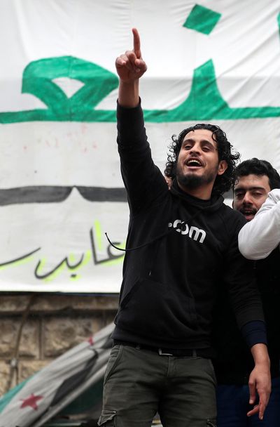 This picture taken on March 15, 2019, shows the  Syrian rebel fighter Abdul Baset al-Sarout taking part in a rally to commemorate the beginning of the Syrian revoltion, in the town of Maaret al-Numan in the jihadist-held Idlib province. The Syrian goalkeeper turned rebel fighter, who once starred in an award-winning documentary, died of his wounds at 27 after fighting regime forces in northwest Syria, a monitor and his faction said. (Omar Haj Kadour/AFP / Tribune News Service)