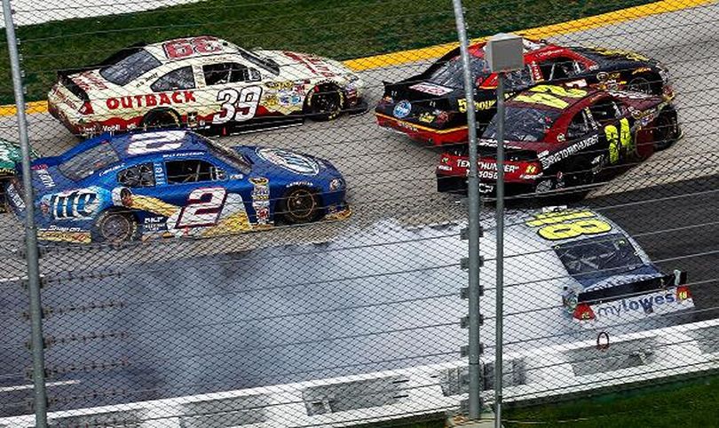 Ryan Newman (No. 39) slides by as Clint Bowyer (No. 15), Jeff Gordon (No. 24) and Jimmie Johnson (No. 48) spin to cause the final caution during the NASCAR Sprint Cup Series Goody's Fast Relief 500 at Martinsville Speedway on Sunday in Martinsville, Va. (Photo Credit: Jeff Zelevansky/Getty Images for NASCAR) (Jeff Zelevansky / Getty Images North America)