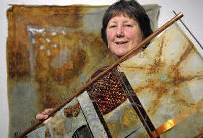 
Fabric Artist Sally Chang holds 